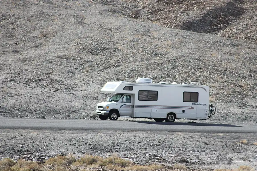 A motorhome parked on a desert road in Death Valley.